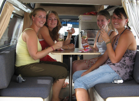 Four dutch girls in the back of a Travelwheels Campervan