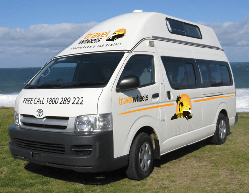 5 person automatic Campervan for Hire in Australia - side view of camper at the beach