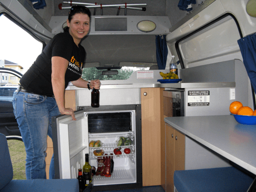 Inside the kitchen of this campervan showing 80L fridge