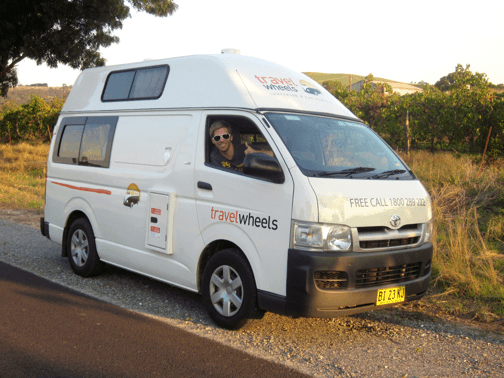 Photo of campervan by side of the road in Australia with happy people!