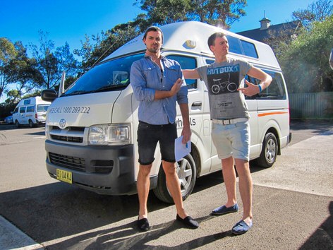 Toyota Hiace 3 person campervans for sale - photo of two customers standing in front of the ex-rental campervan they purchased from Travelwheels Campervans Sales in Sydney - Call 0421101021