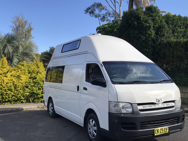 Toyota Hiace ex-rental campervans for sale - front drivers side view of a five person automatic Toyota campervan for sale from Travelwheels Campervans Sydney