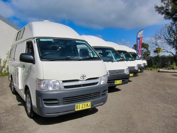 ex-hire Toyota Hiace campervan for sale - photo showing a row of Toyota Hiace Campervans for sale at our Botany used campervans for sale yard.