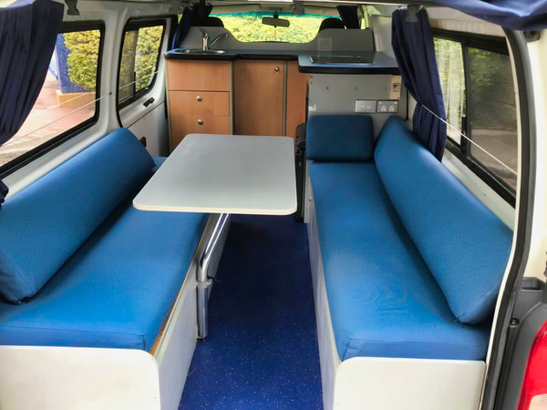 Toyota Hiace hitop campervans for sale - view of the lounge kitchen area