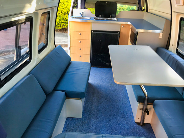 Toyota Hiace Automatic Campervan combined kitchen and lounge area
