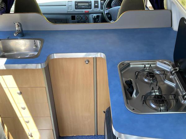 Kitchen area inside Toyota Hiace Campervan