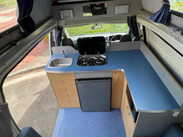 View of the kitchen inside Toyota Automatic Campervan for sale