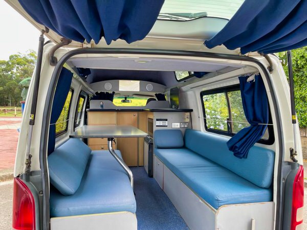 Toyota Hiace hitop campervan view of the open plan lounge area