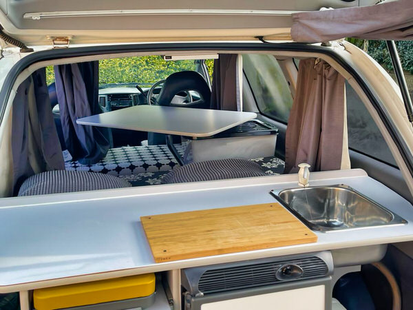 Toyota Tarago Campervans for sale Sydney - Automatic 2 Person - view of the lounge and double bed inside this campervan