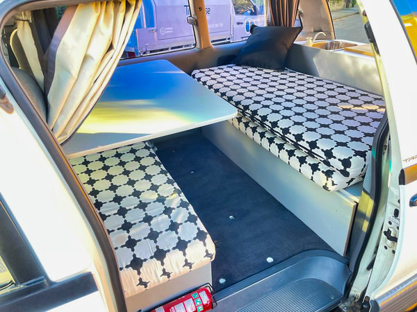 Lounge area inside Toyota 2 Person campervan for sale