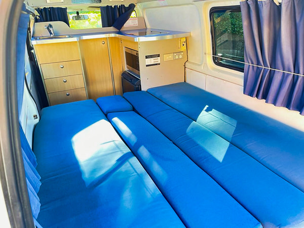 Toyota Hiace Campervan for sale - photo showing the large double bed in the back of the camper