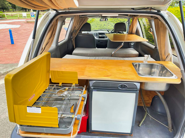 Ex rental campervan for sale - photos of the kitchen with fridge, sink and two burner gas stove