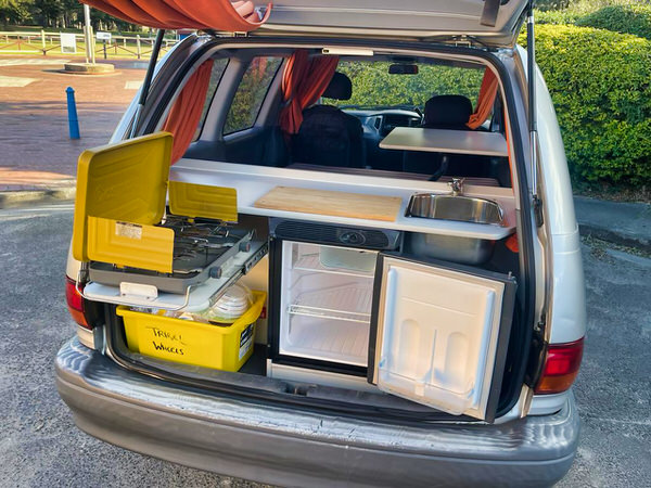 Toyota Automatic camper for sale - photo showing the kitchen in the back of the camper with fridge, cooker and sink