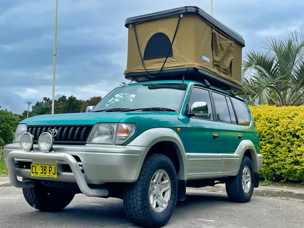 Toyota Prado for sale - photo showing the front passenger side angle view with roof tent open