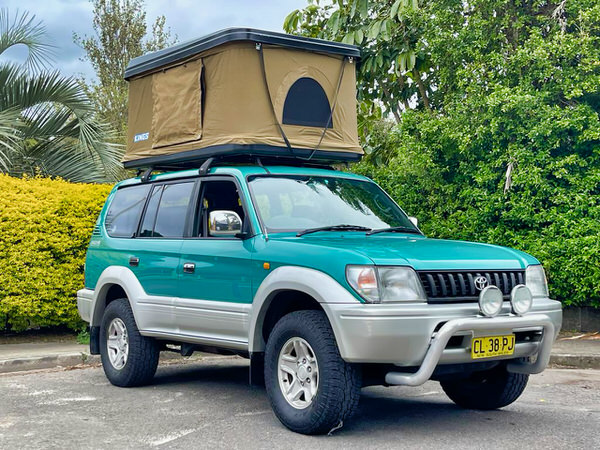 Roof Top Tent - photo of a used 4x4 for sale with Roof tent open