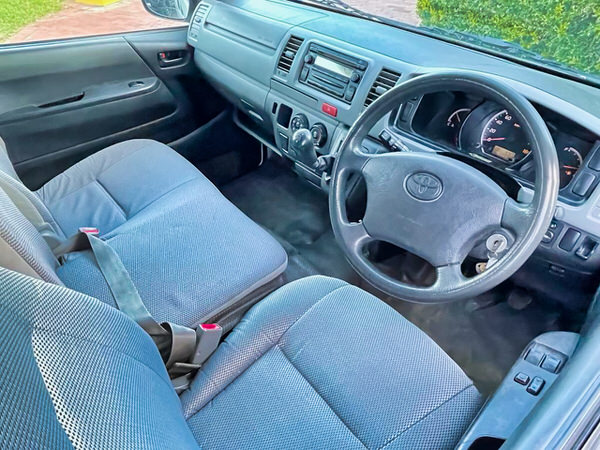 Used Campervan for sale in Sydney - Photo showing the view inside the front of the Toyota Hiace Campervan sitting in the drivers seat looking forwards