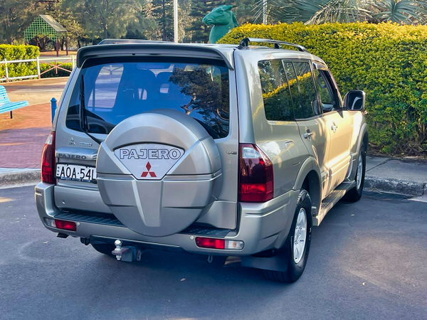 Mitsubishi Pajero for sale from Travelwheels Campervans - 2003 Automatic 3.5L model - photo showing the rear drivers side angle view