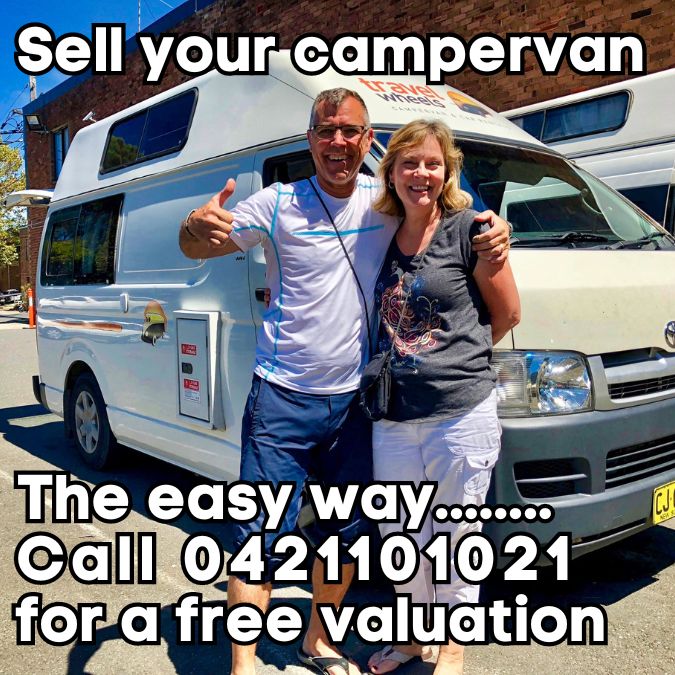 Sell your campervan the easy way - couple in front of a Toyota Hiace who just sold it to travelwheels campervans