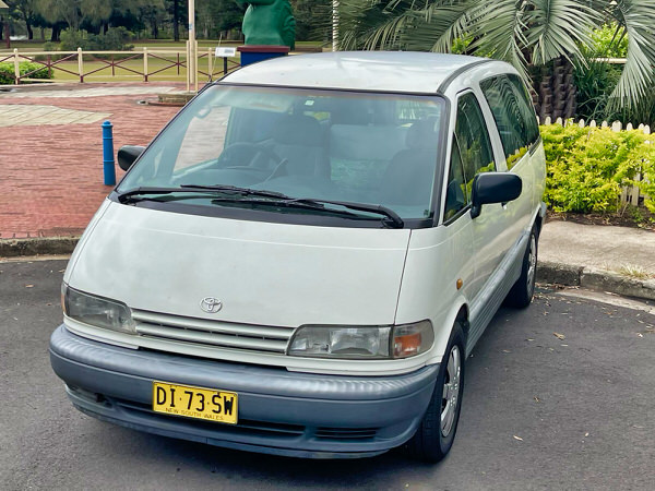 Toyota Tarago campervans for sale in Sydney - Automatic 2 person campervan model. Photo of the front passengers side angle view