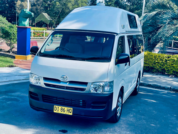 Ex-rental Toyota hiace campervans for sale in Sydney - Photo showing the front passenger side angle view 