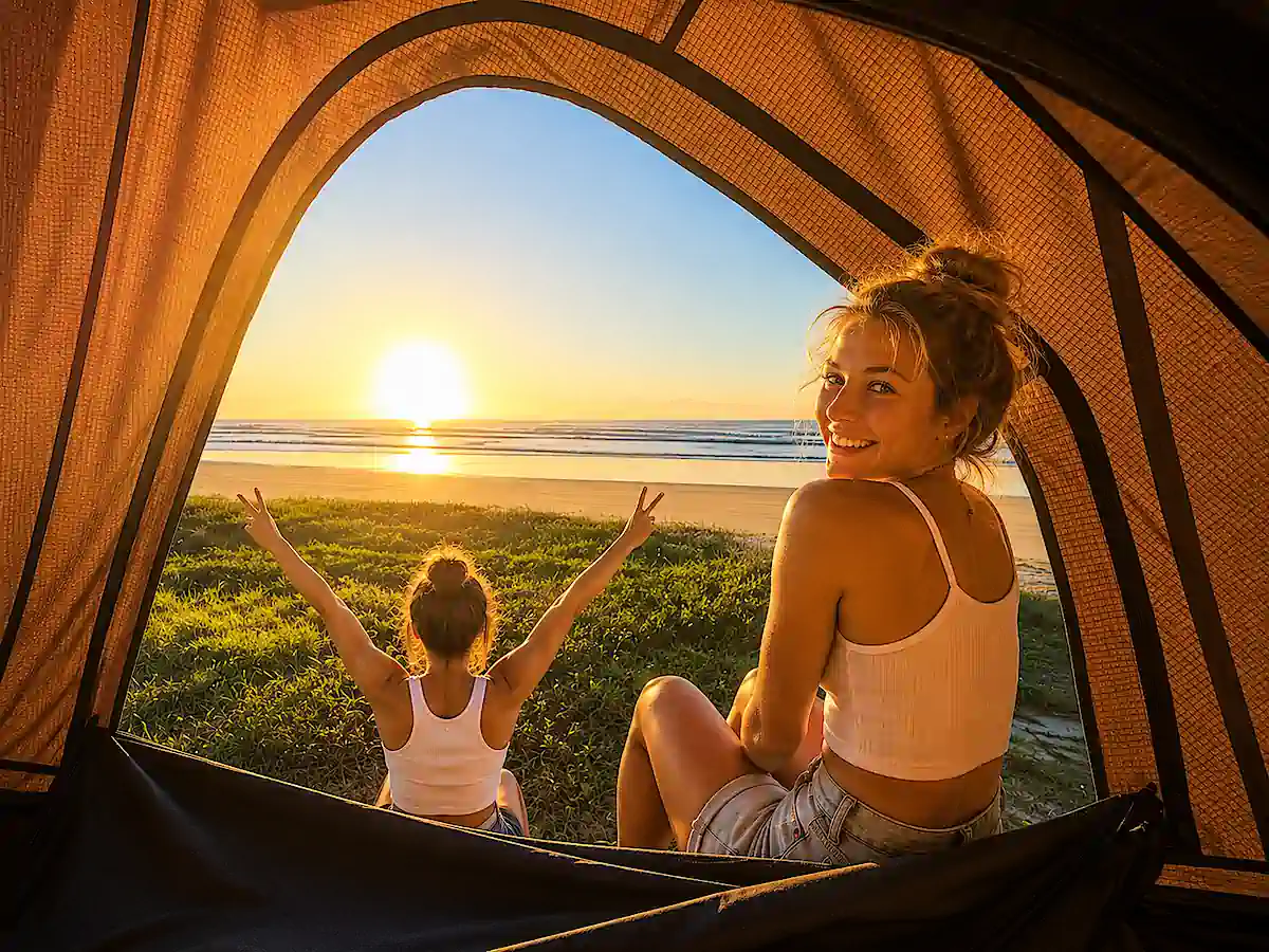 customer review photo - two women waking up from the roof tent and seeing the sun