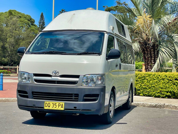 Toyota Hiace hitop campervans for sale in Sydney at Travelwheels Campervans in Botany - Photo showing the front passenger side angel view of the campervan