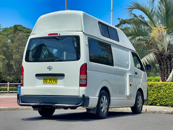 Toyota Hiace hitop campervans for sale in Sydney at Travelwheels Campervans in Botany - Photo showing the rear driver side angel view of the campervan