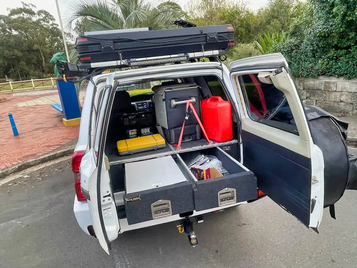 Used 4x4 for sale with roof top tent - photo showing rear kitchen and storage area