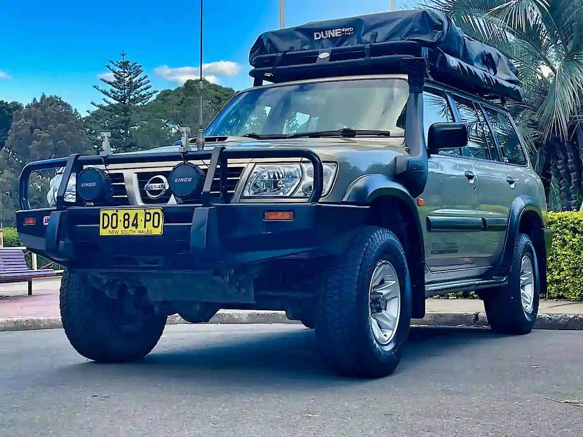 4x4 camper for sale at Travelwheels Sydney. Front passenger side view with Roof Tent