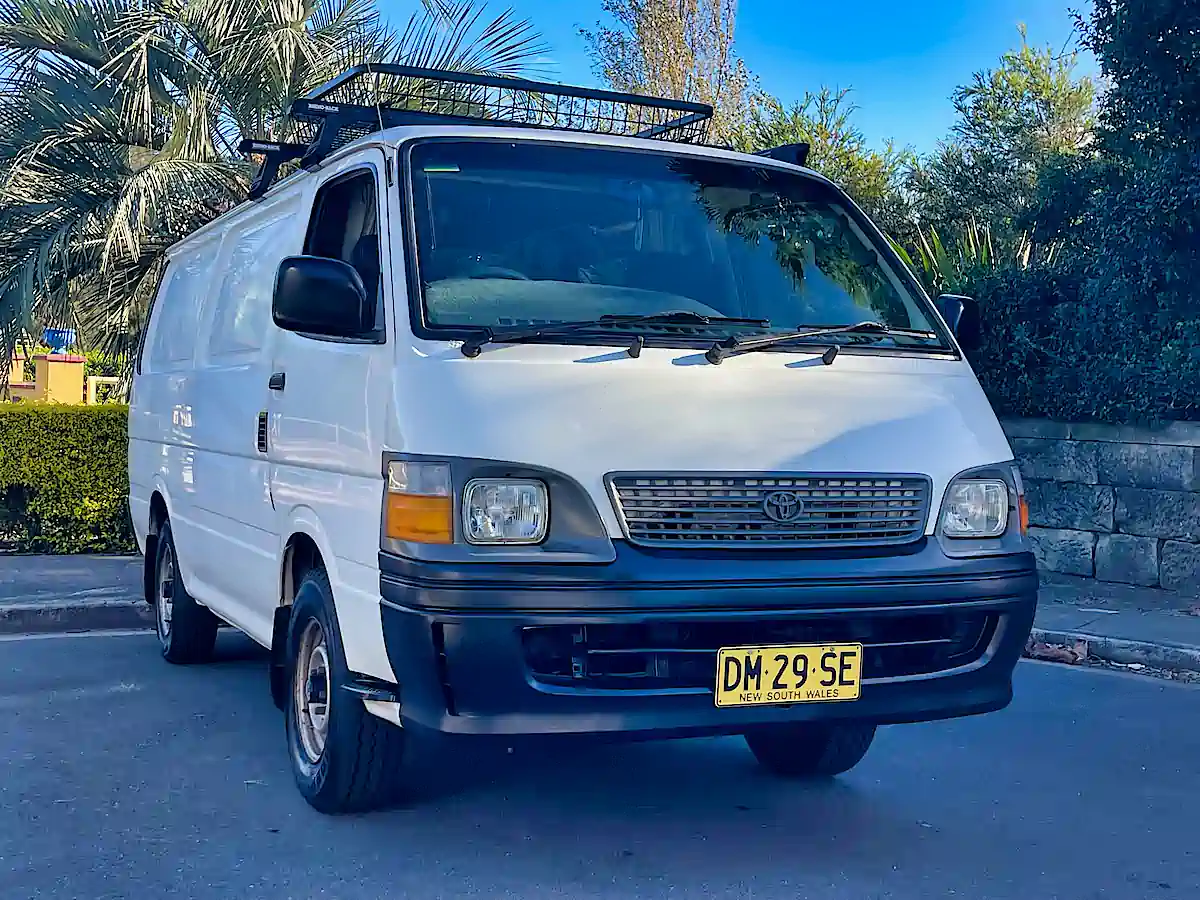 Used Toyota campervan for sale with roof rack - front driver view