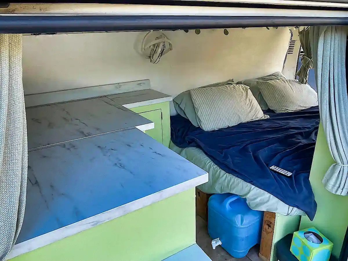 Combined kitchen lounge and bedroom in this Toyota Campervan for sale