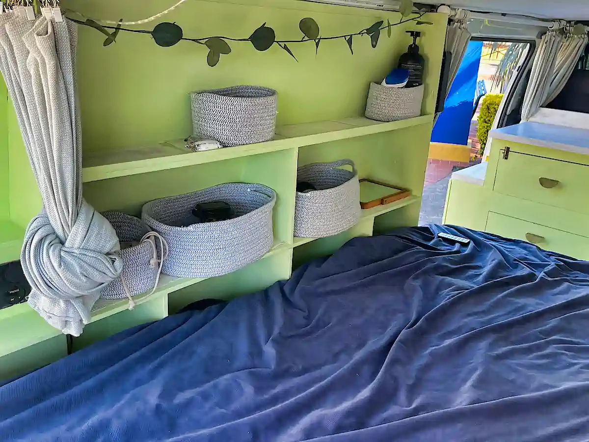 loads of storage space and shelves inside this used Toyota campervan for sale