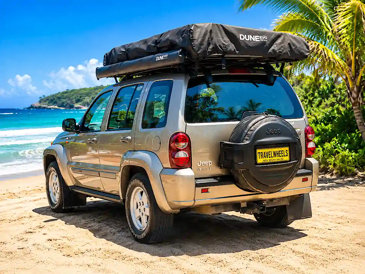 Used Jeep for sale. Rear passenger side view at the beach