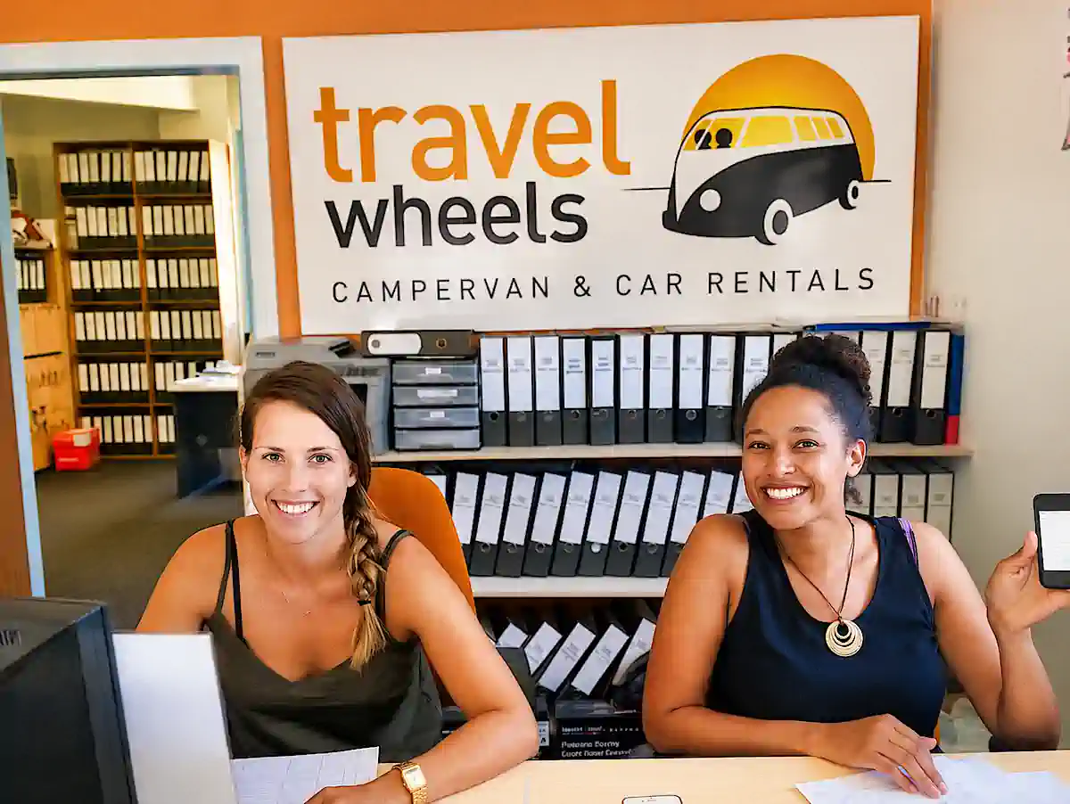 German-speaking Travelwheels staff helping international travellers at the Sydney office