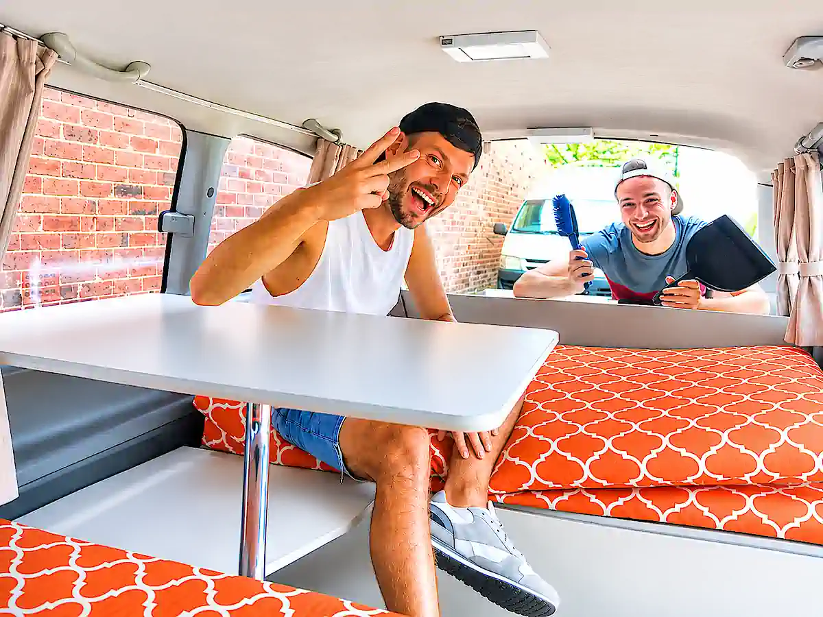 backpacker campervan for sale - two customers in the rear lounge