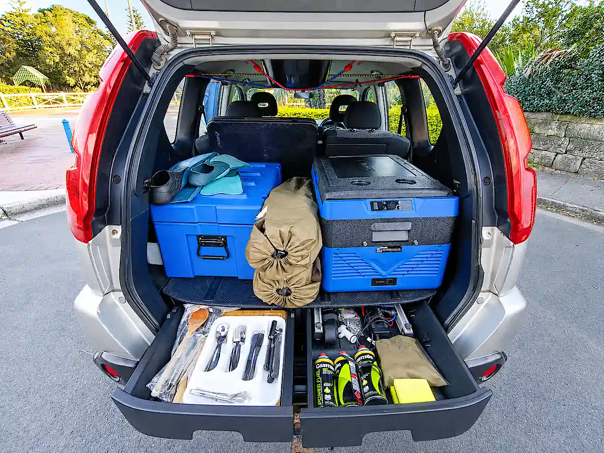 Used Nissan 4x4 for sale with Roof Tent - photo shows the rear kitchen with everything included from Travelwheels Campervans
