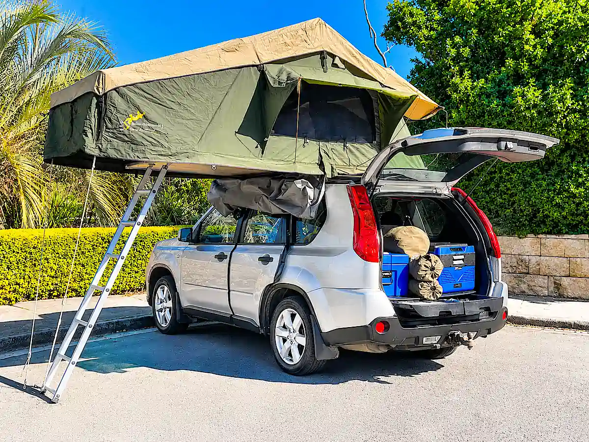 Used Nissan 4x4 for sale with Roof Tent open in the image - Travelwheels Campervans Sydney