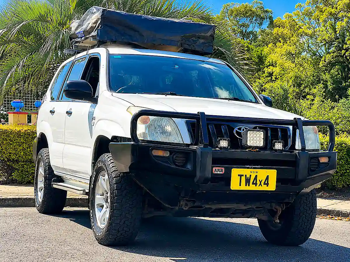 Used Toyota Prado for sale with Roof tent at Travelwheels Sydney - front driver side view