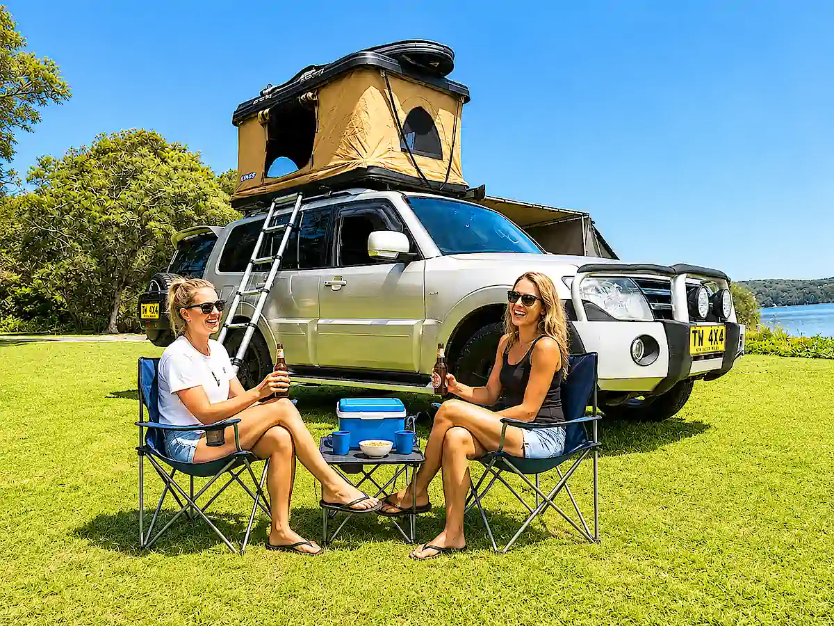Mitsubishi Pajero for sale with Roof tent - drinking beer by the driver side view