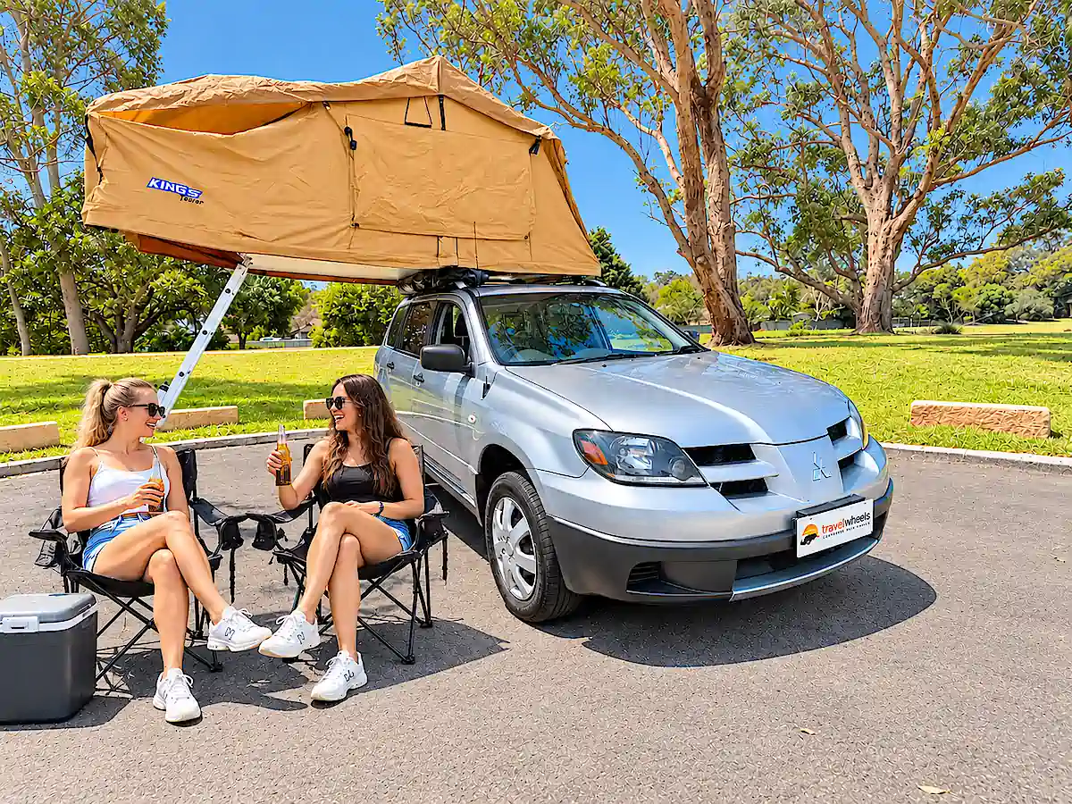 Roof Tent SUV for sale - two women drinking beer in front of the vehicle with roof tent open