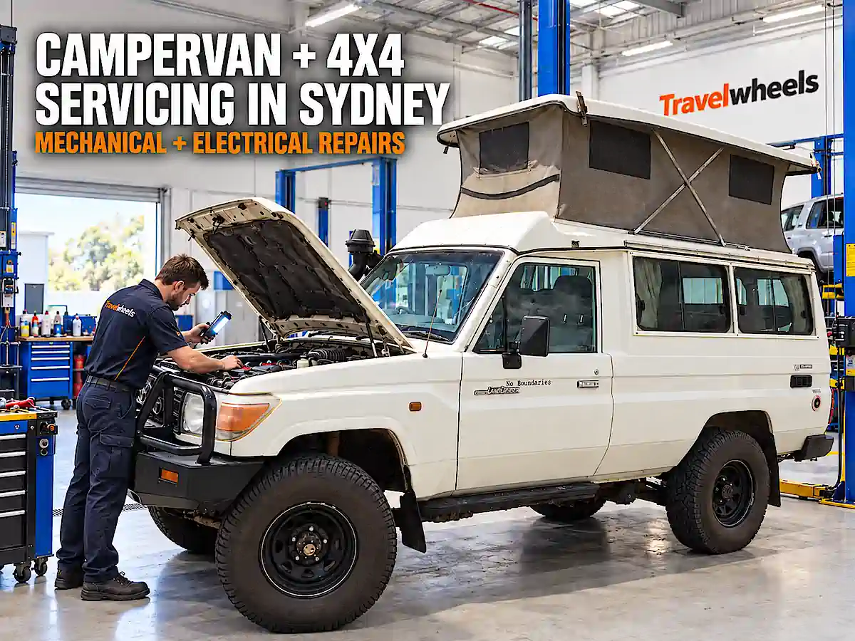Mechanic servicing a Toyota Land Cruiser pop-top bush campervan and 4x4 at Travelwheels in Botany, Sydney